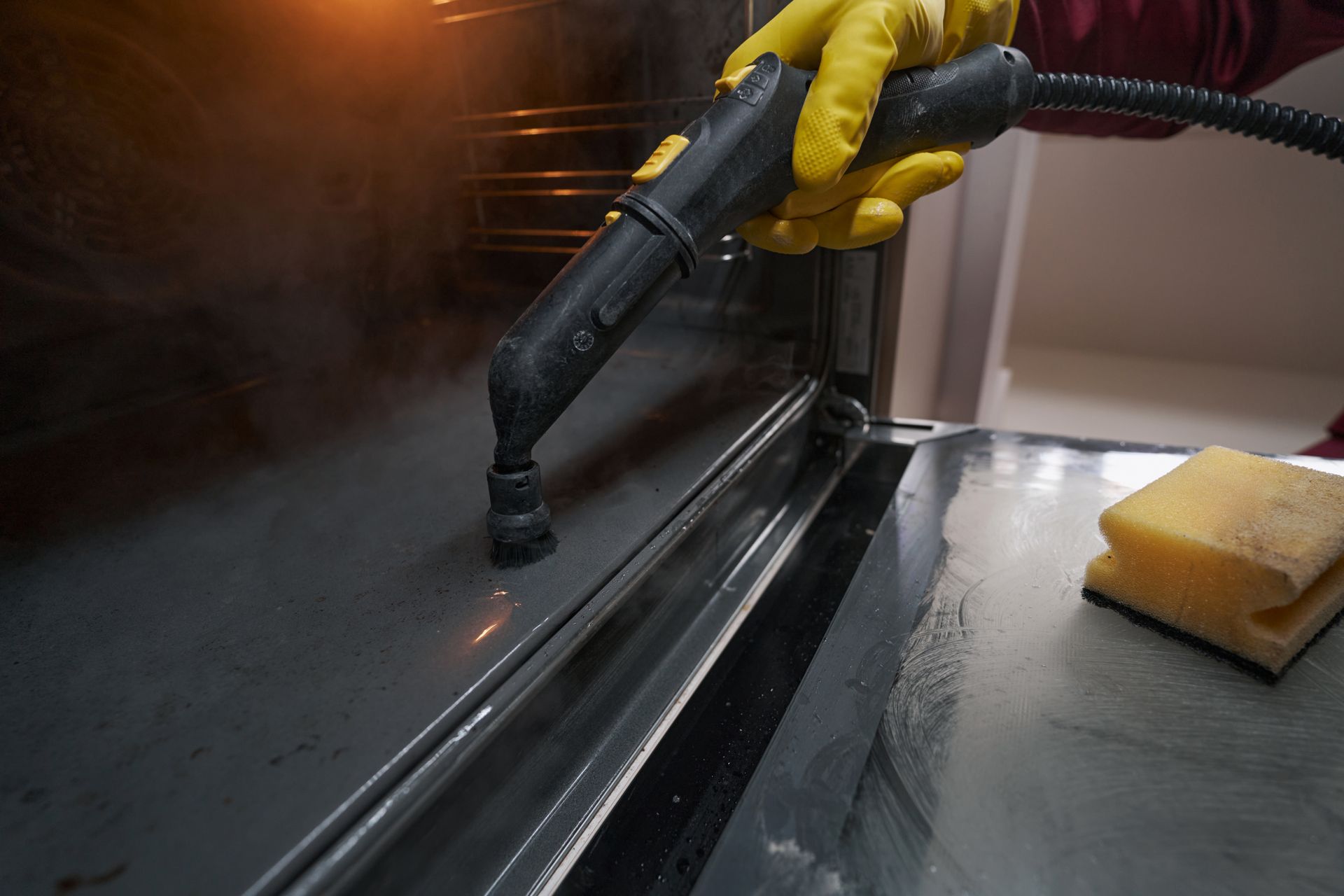 A professional Broom & Rag Co. cleaner disinfecting a surface